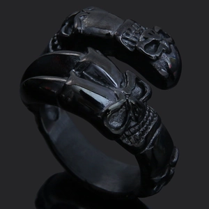 Macro shot of Viking Thor's Hammer ring with detailed skull engravings in vintage black steel
