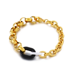 Vintage chunky gold chain link bracelet with black and white geometric resin charms