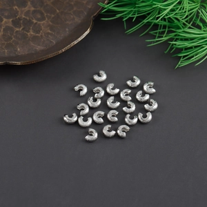 Detailed view of silver glitter moon beads for DIY jewelry making and bead fixing