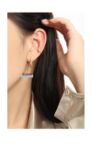 Minimalist silver geometric hoop earrings 21mm size shown on a model side profile