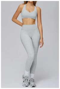 Close-up of gray heathered texture yoga set featuring high-waist leggings and sports bra