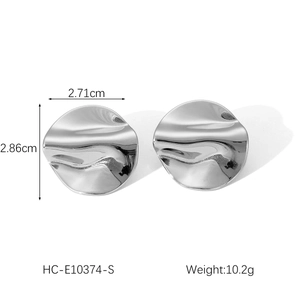 Detail view of silver irregular hammer textured earrings with dimensions and weight info