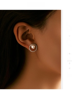 Macro view of S925 sterling silver geometric circle earrings with pearl and diamonds
