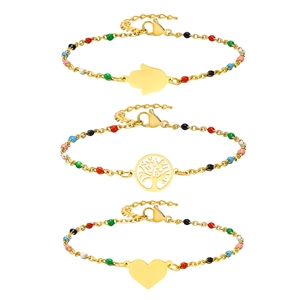 Titanium steel beads bracelet with gold plating featuring Hamsa Hand and Tree of Life charms