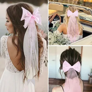 Pink bow bridal veil with pearls, elegant hair clip for weddings and engagement photos