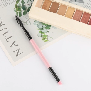 Professional dual-ended eyebrow and eyelash brush with pink wooden handle and dual tips