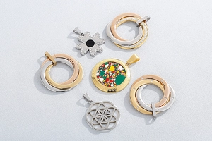 Detailed collection of assorted stainless steel pendants including clover and trinity rings