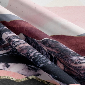 Close-up of abstract mountain wall tapestry with gold foil lines and marble texture