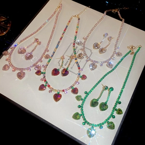 Detail view of heart-shaped zircon jewelry sets with necklaces and earrings in four colors