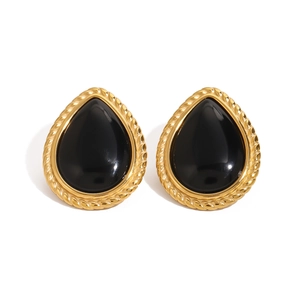Vintage gold-plated oval earrings with large black teardrop gemstones and twisted metal trim