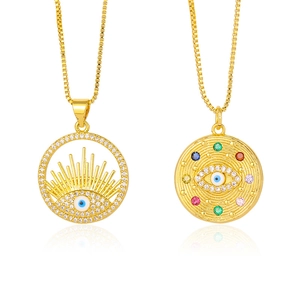 Golden Evil Eye pendant necklace with sparkling colorful rhinestones on a white background