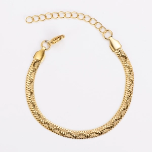 Macro shot of gold flat snake chain with adjustable lobster clasp and extension link