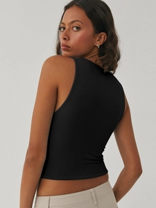 Slim fit black ribbed tank top showing the back cut and U-neckline on a female model