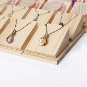 Solid wood jewelry display stands for necklaces and pendants on white background