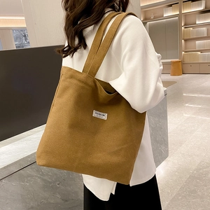 Brown large capacity canvas tote bag with shoulder straps for daily casual fashion use