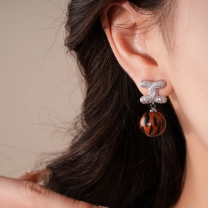 Retro leopard print drop earrings with silver pins and sparkling crystals for women
