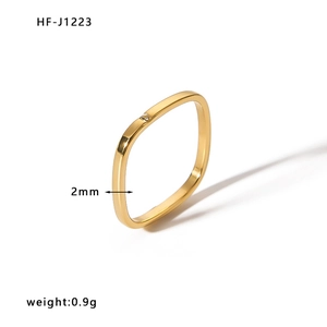 Detail view of 2mm square gold ring with tiny diamond inlay showing 0.9g weight
