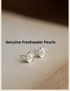Detail of silver double-layer lotus earrings with natural freshwater pearls