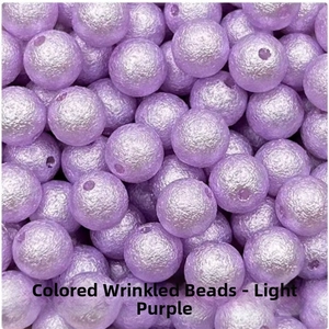 Macro shot of light purple wrinkled surface ABS imitation pearl round loose beads