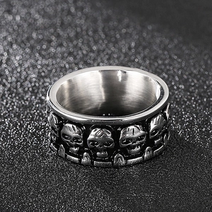 Macro view of vintage silver gothic skull ring with embossed skeletal pattern