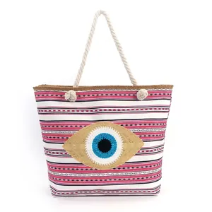 Striped canvas beach tote bag with Evil Eye embroidery and rustic rope handles