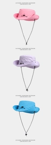 Close-up of lightweight nylon sun hats in pink, light purple, and blue with windproof cords