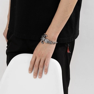 Close-up of vintage silver crocodile bracelet showing realistic scale texture on wrist