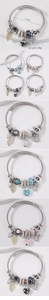 Detail view of adjustable DIY charm bracelet with butterfly, heart and crown pendants