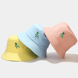 Three colorful cotton bucket hats with cute green frog embroidery in yellow blue and pink