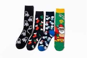 Close-up of four festive Christmas crew socks featuring snowman and Santa Claus patterns