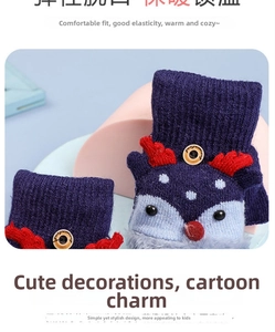 Detail of warm knitted winter gloves with cartoon elk design and soft fur trim