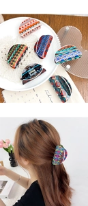 Polka dot acrylic hair claw clips set shown in still life and model wearing style