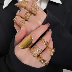Minimalist stainless steel gold heart open rings set for women worn by a fashion model