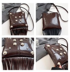 Detail of dark brown glossy bag featuring silver metal rivets and long fringe tassels