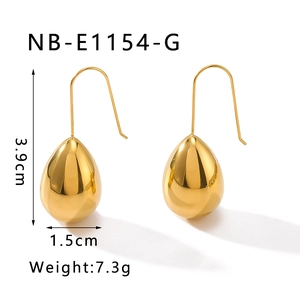 Close-up of golden teardrop earrings showing 3.9cm length and 1.5cm width dimensions