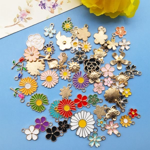 Assorted colorful enamel flower charms in daisy and cherry blossom styles for DIY jewelry