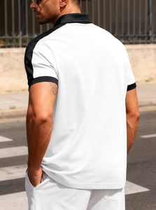 Street view detail of casual white polo shirt with black contrast collar and sleeve trim