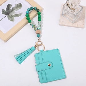 Teal beaded wristlet keychain with PU leather card holder and elegant tassel accessory