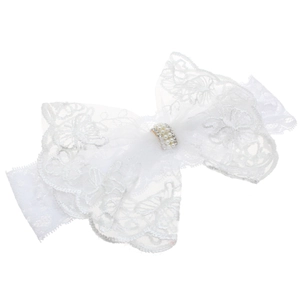 White lace bow baby headband with pearls and rhinestones decoration on white background