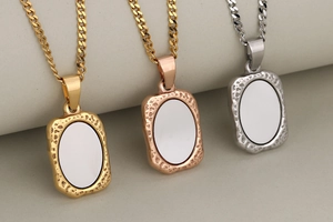 Detailed view of rectangular mirror pendants in gold rose gold and silver on cuban chains