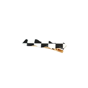 Checkerboard pattern wavy hair clip with black and white grid and golden metal duckbill clamp