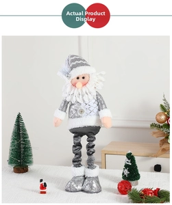 Close-up of a silver Nordic Christmas elf doll with sequins, long legs, and white beard