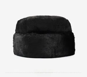 Side view detail of black faux fur winter hat showing soft texture and glossy finish