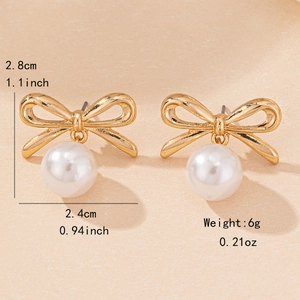 Elegant gold bow earrings with white pearl pendants showing dimensions 2.8cm by 2.4cm