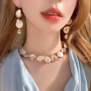 Elegant gold shell and irregular pearl necklace earring set for beach vacation style