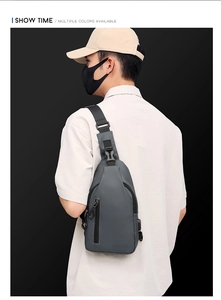 Gray outdoor chest bag for men with USB charging port shown in a stylish back view