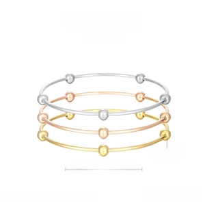 Minimalist stainless steel bangles set with five beads in silver, gold, and rose gold