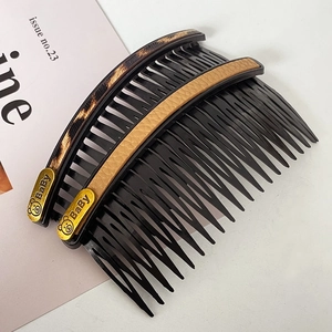 Set of two bear hair combs in leopard print and beige leather with golden baby charms
