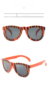 Front and 45-degree side view of kids orange and black striped party sunglasses