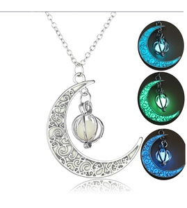Detailed comparison of silver alloy moon and pumpkin pendant with glowing stone effect